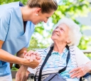 St Luke Nurse With Resident On Riverview Terrace2